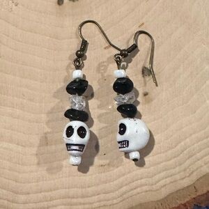 Clear quartz and black onyx crystal skull earrings